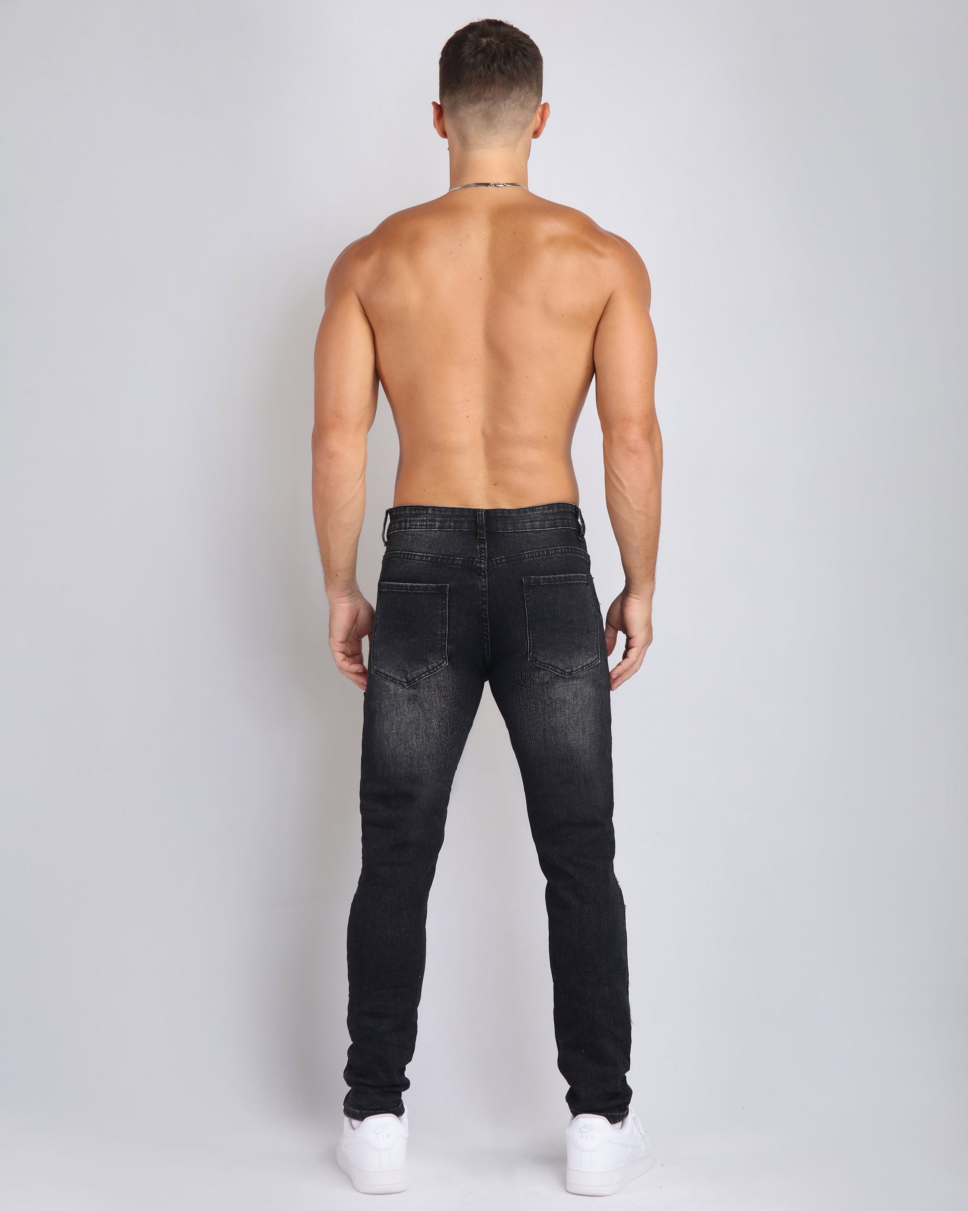 Logeqi trendy ripped black jeans designed for a stylish and modern look from the back