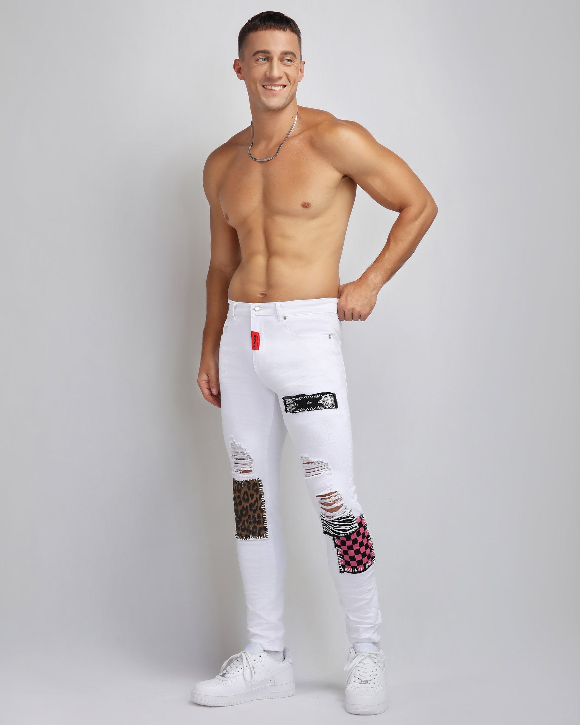 Trendy ripped white jeans by Logeqi featuring colorful patches and a stylish slim fit