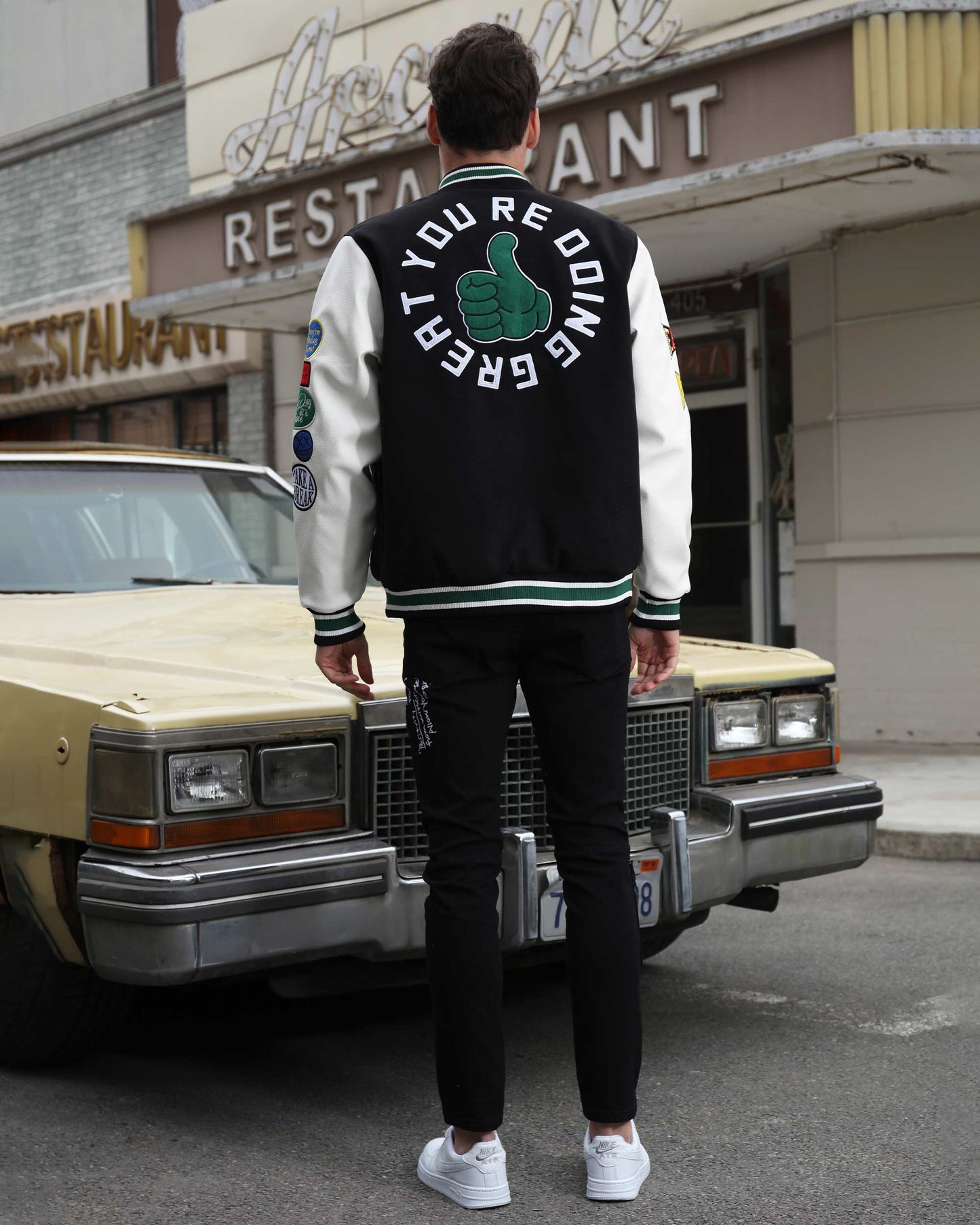 Logeqi urban graffiti jeans styled with a casual jacket and sneakers, perfect for urban streetwear