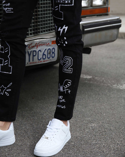 Logeqi urban graffiti jeans featuring bold designs and a slim fit style for streetwear enthusiasts