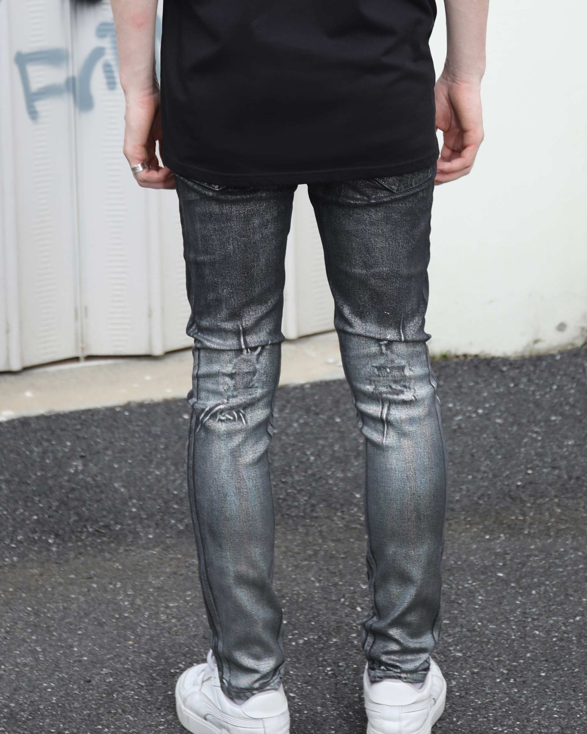 Logeqi gradient ripped black jeans with distressed detailing worn by person standing outdoors