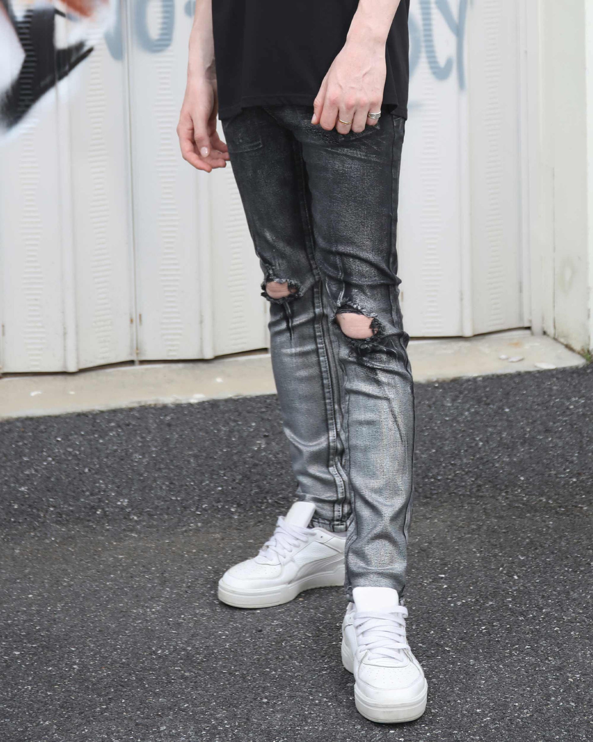 Logeqi gradient ripped black jeans with distressed knee details worn with white sneakers