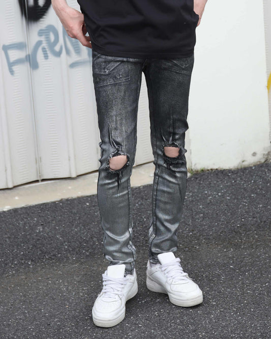 Logeqi gradient ripped black jeans with distressed knee holes worn with white sneakers