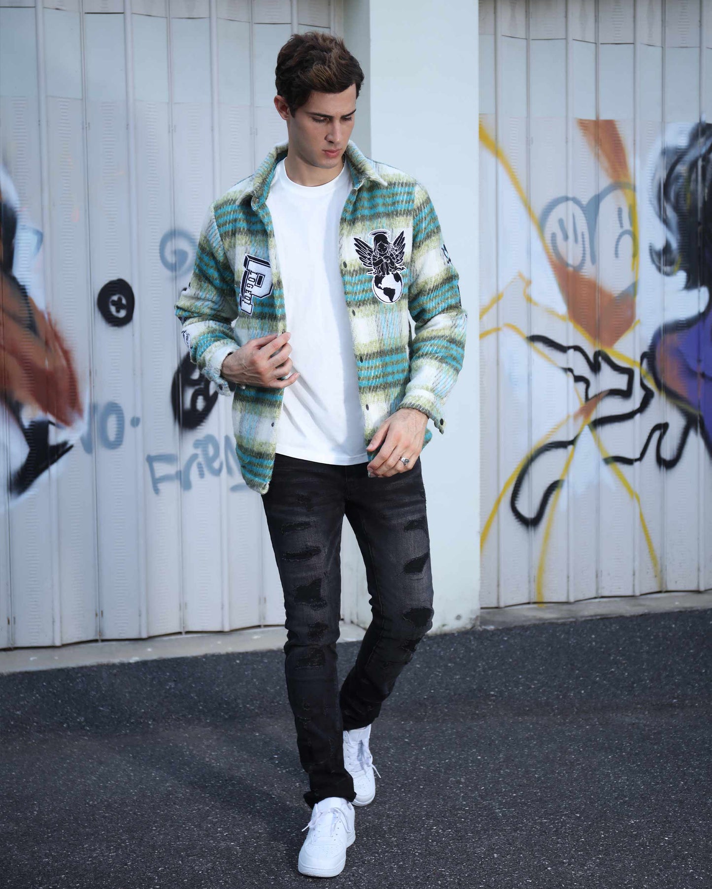 Logeqi insulated plaid moto jacket in green tones worn by man with white shirt and black jeans