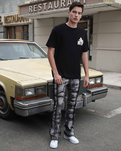 Logeqi vintage black jeans with a distressed design paired with a black t-shirt and sneakers