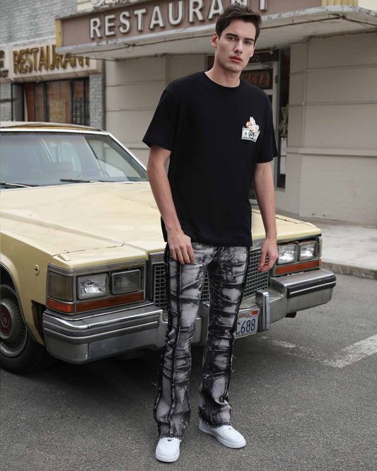 Logeqi vintage black jeans with a distressed design paired with a black t-shirt and sneakers