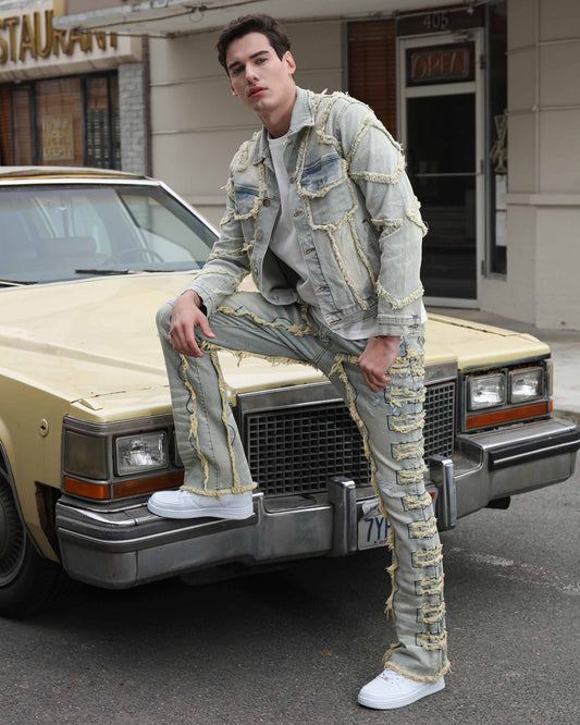 Logeqi vintage denim jacket worn by a model with distressed detailing next to a classic car