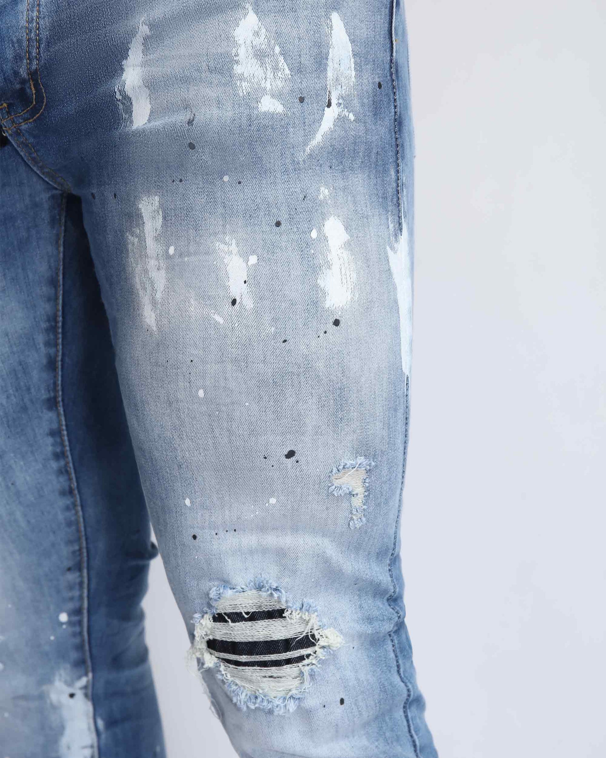 Logeqi vintage ripped denim jeans in light blue with distressed details and stylish design