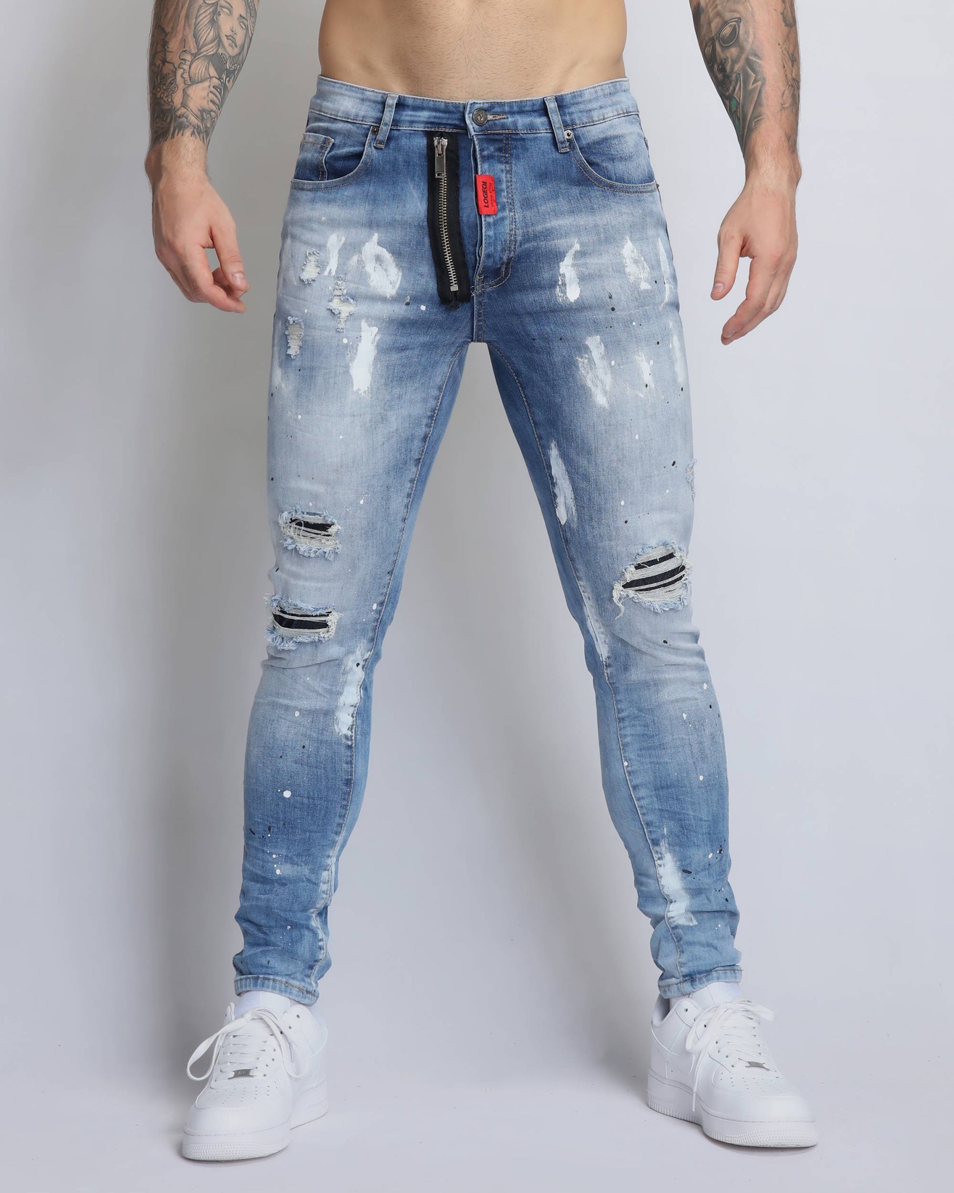 Logeqi vintage ripped denim jeans in light blue with distressed details and a slim fit