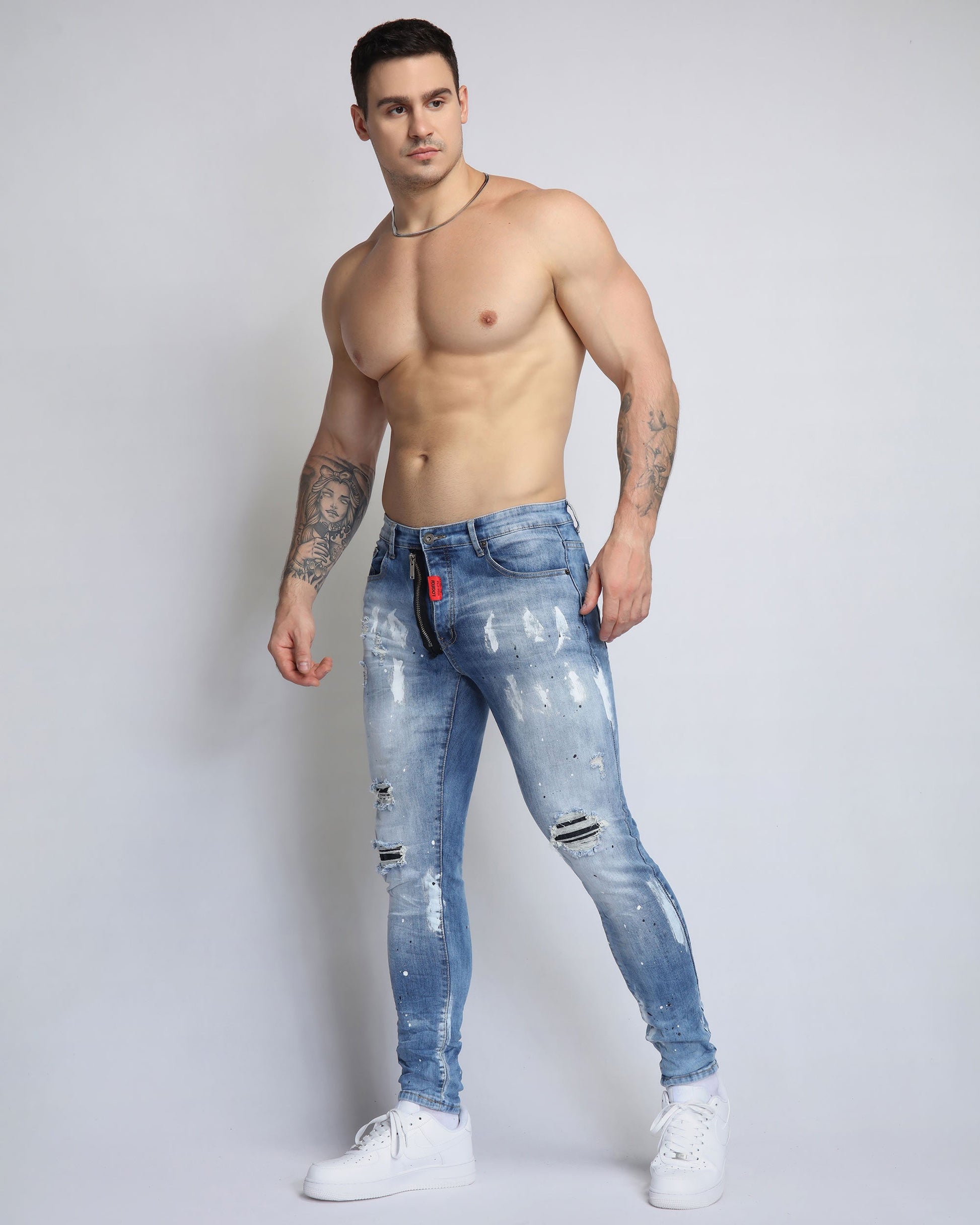 Logeqi vintage ripped denim jeans in light blue worn by a model showing a stylish fit