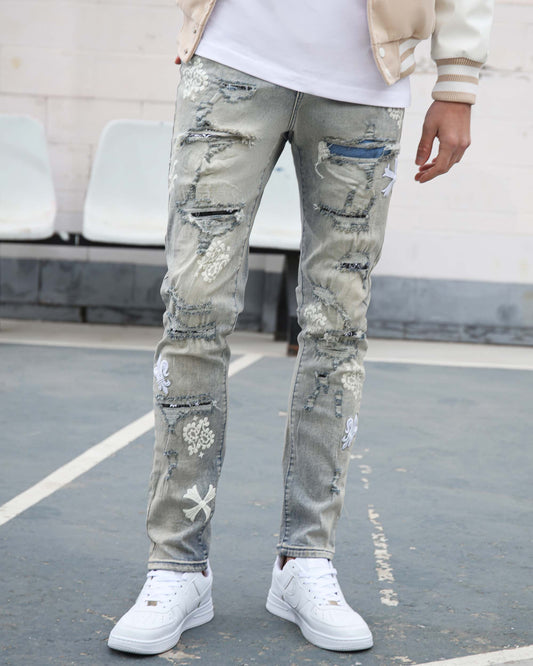 Logeqi vintage trendsetter denim jeans with distressed and embroidered detailing paired with white sneakers