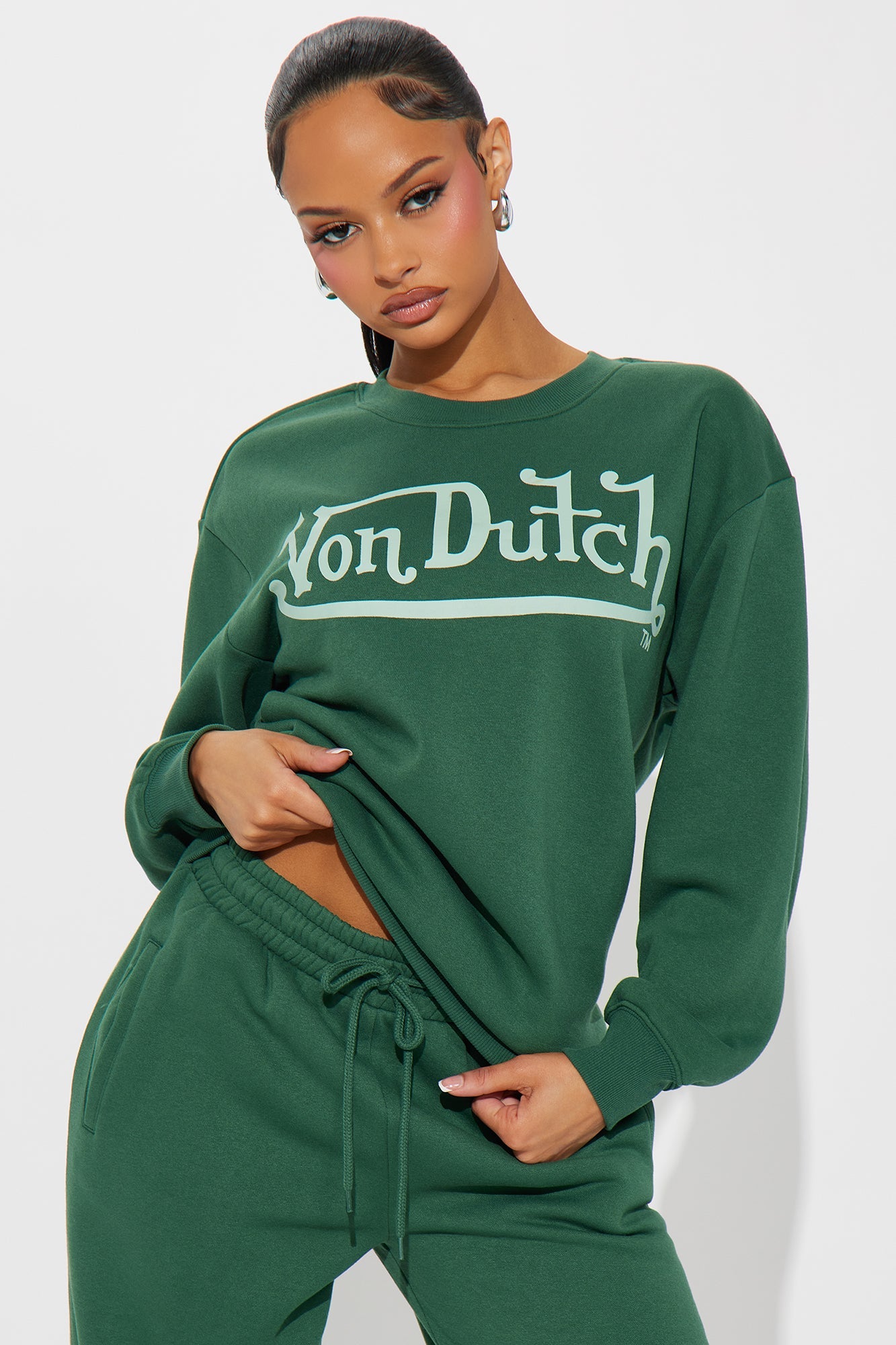 Von Dutch distressed crewneck sweatshirt in green featuring a stylish logo design on a relaxed fit