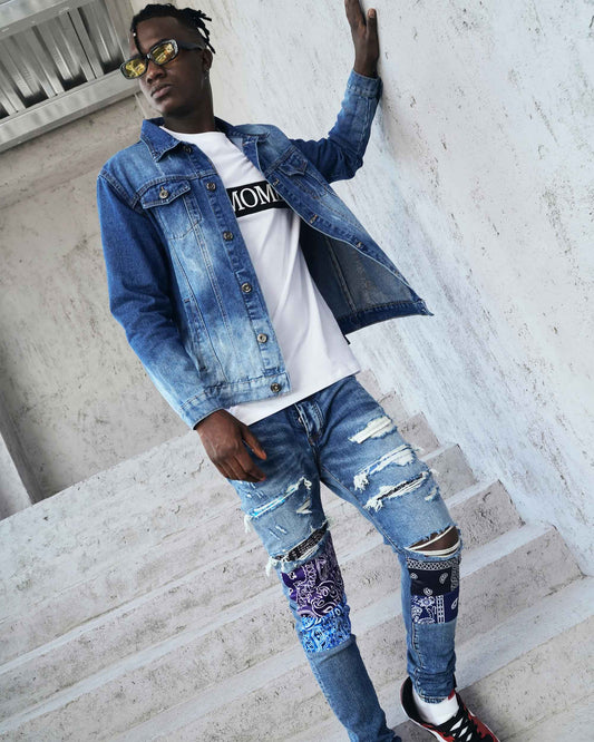 Trendy washed blue denim jacket styled with ripped jeans and sunglasses for a casual look
