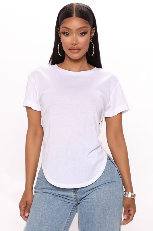 Fashion Nova white cuffed sleeve top paired with casual jeans for a stylish look