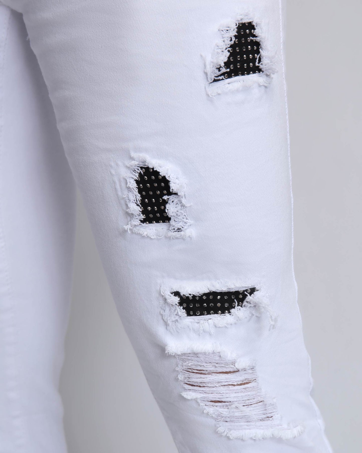 Logeqi white ripped jeans with diamond patch featuring unique distressed detailing