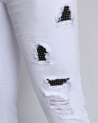 Logeqi white ripped jeans with diamond patch featuring unique distressed detailing