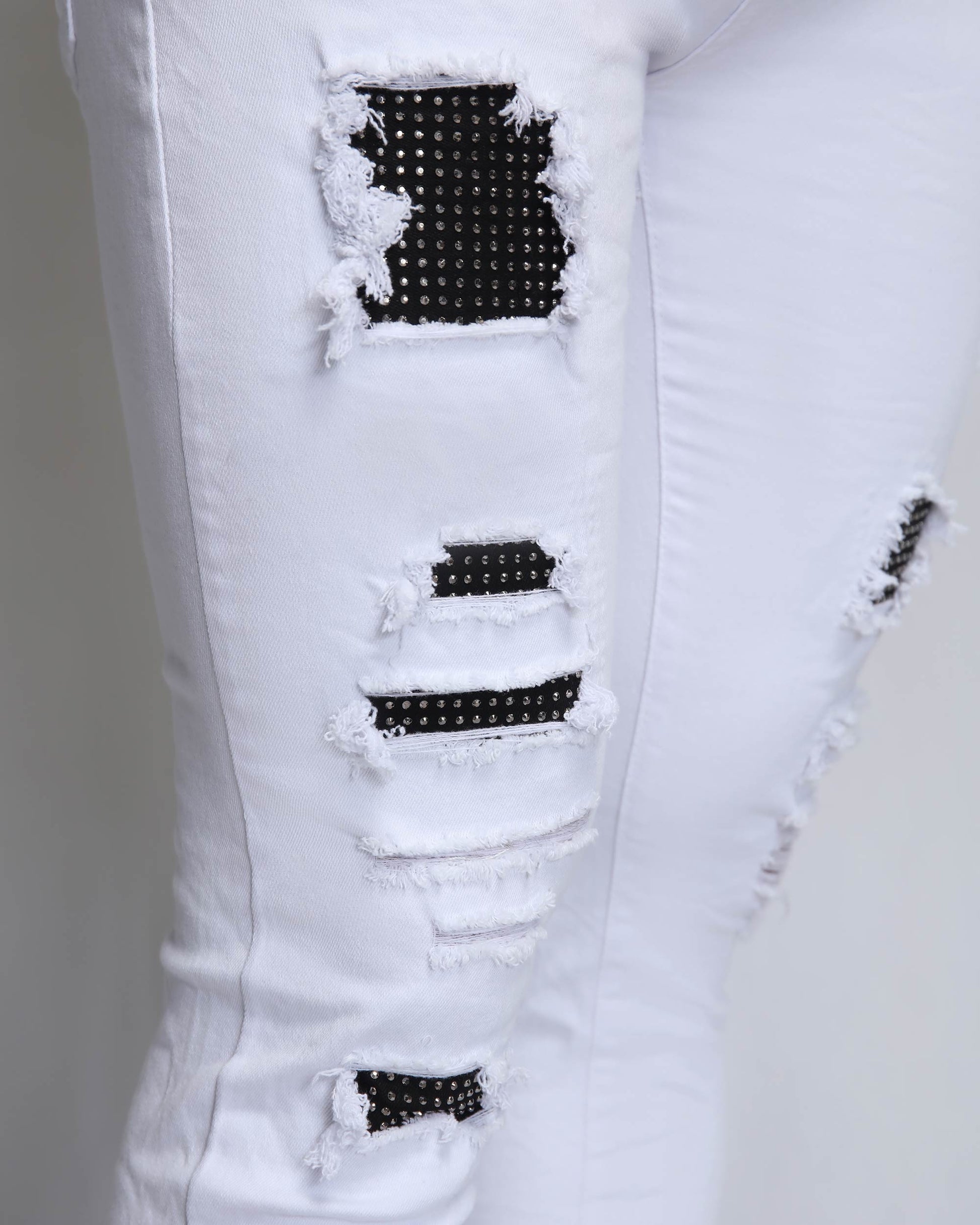 Logeqi white ripped jeans with diamond patch featuring distressed detailing for a trendy look