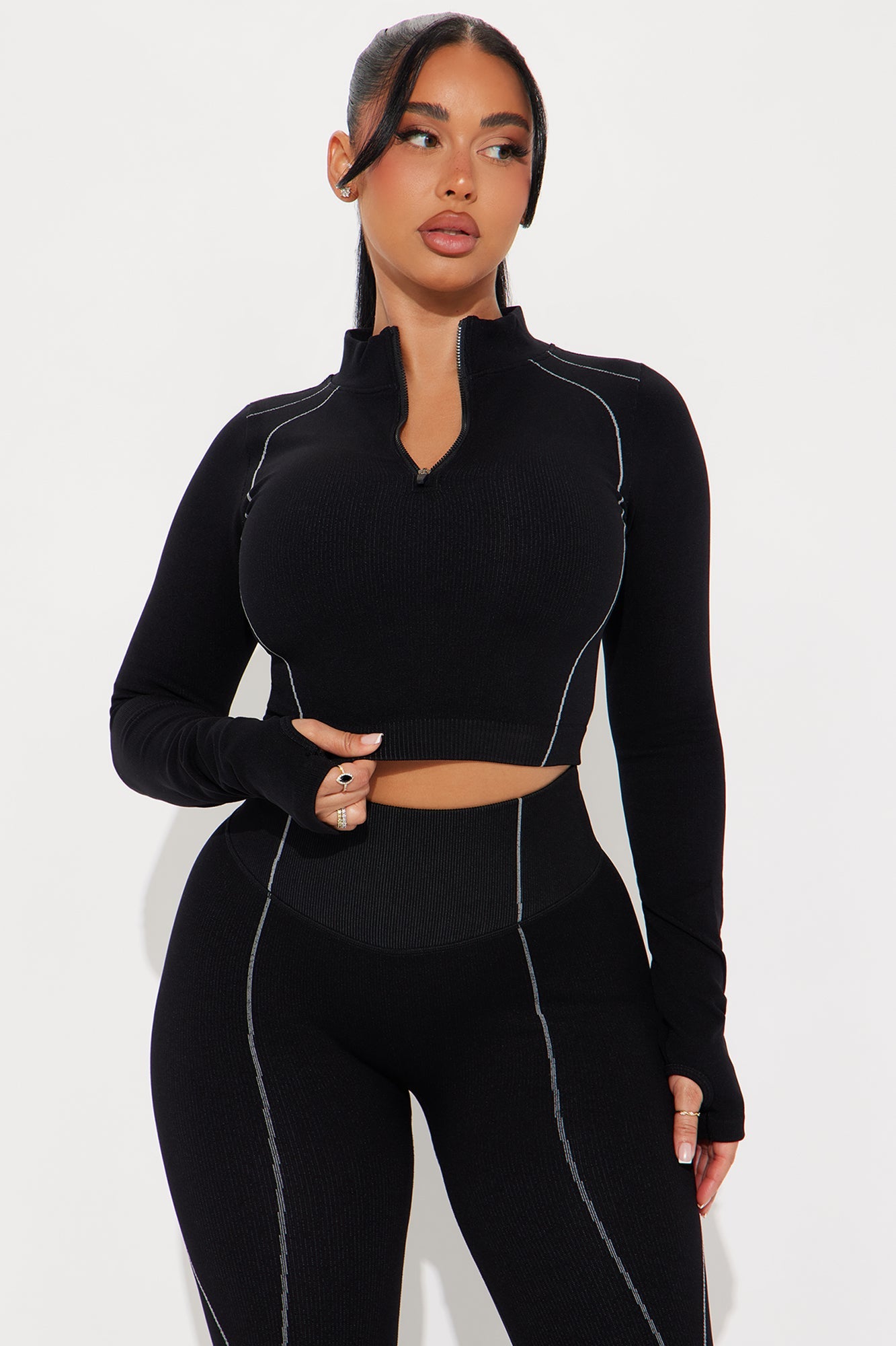 Fashion Nova women's black activewear set with a stylish cropped top and high-waisted leggings