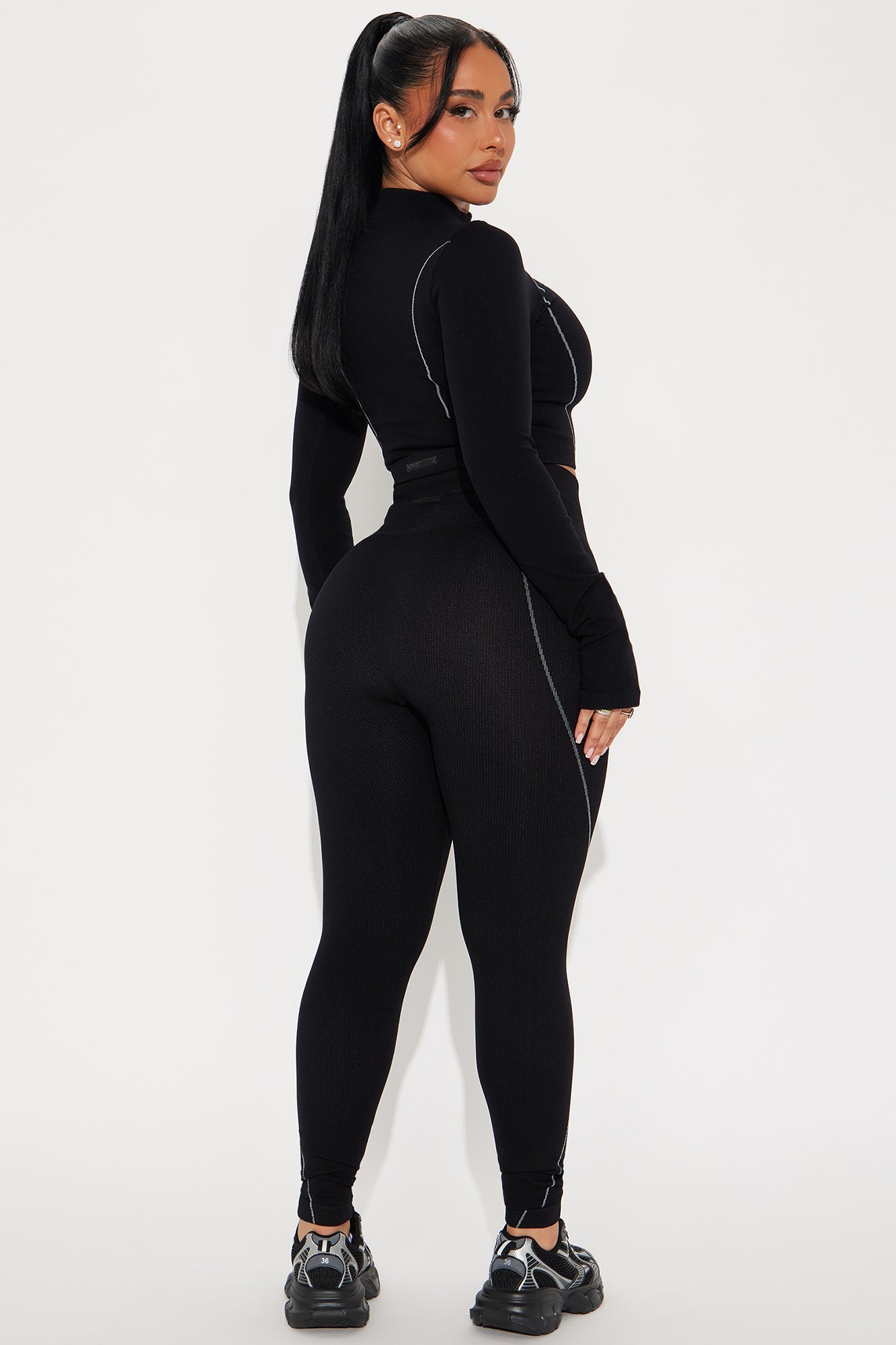 Fashion Nova women's black activewear set with long-sleeve top and fitted leggings for workouts
