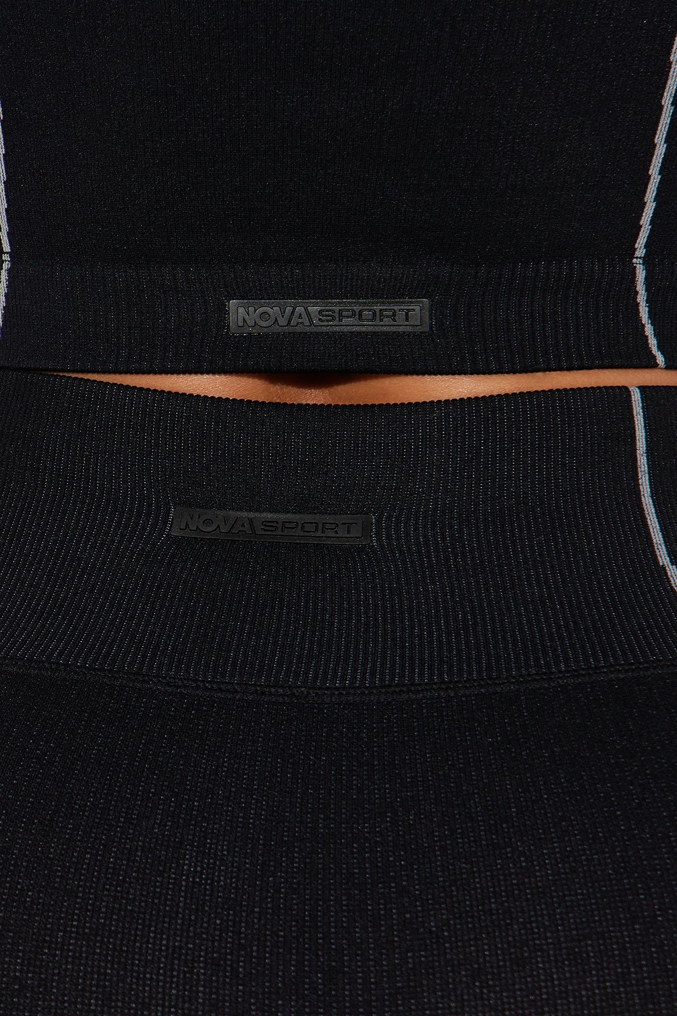 Close-up of Nova Sport women's black activewear set featuring a snug waistband and stylish design
