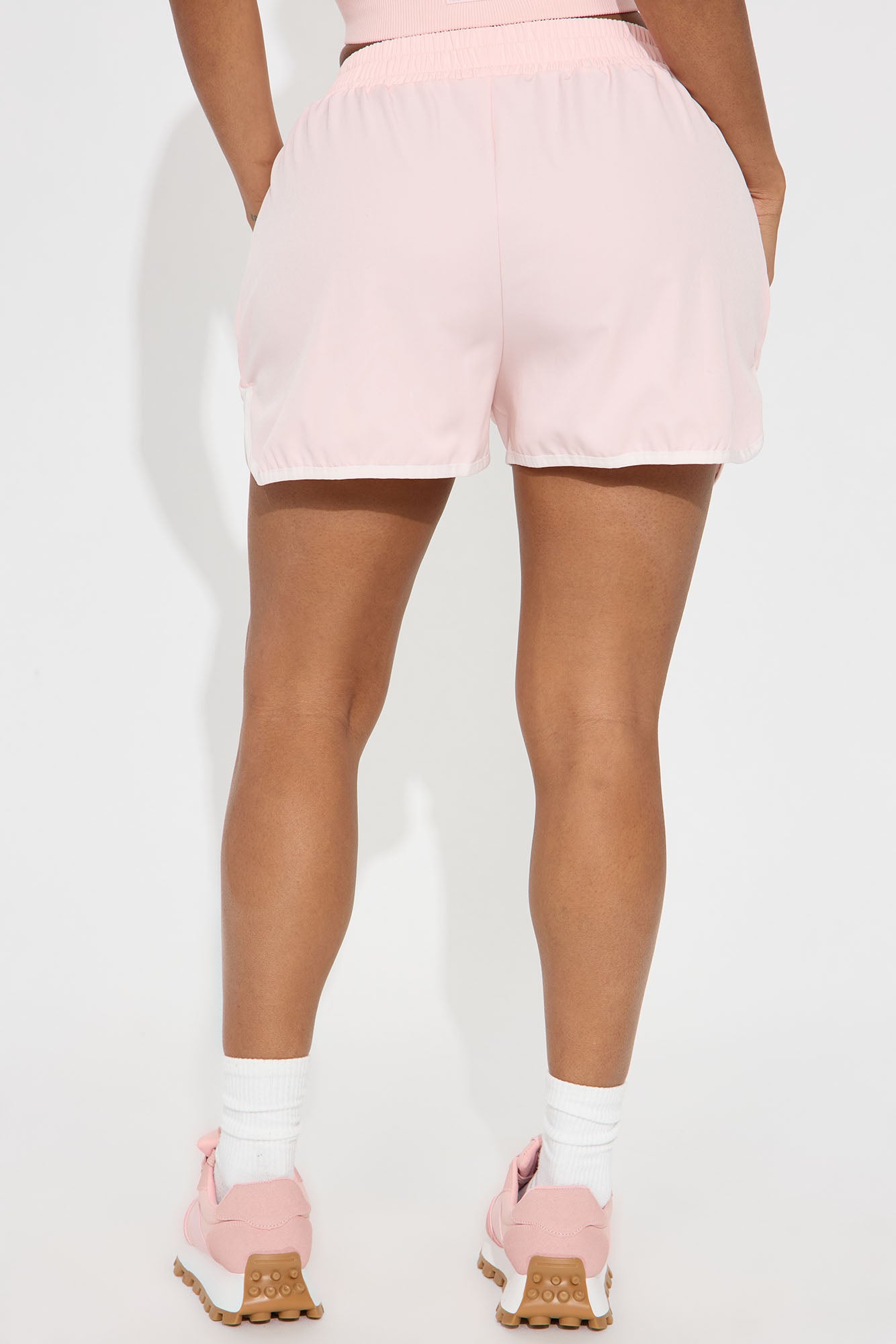 Back view of women's blush active shorts from Fashion Nova, perfect for workouts and casual wear