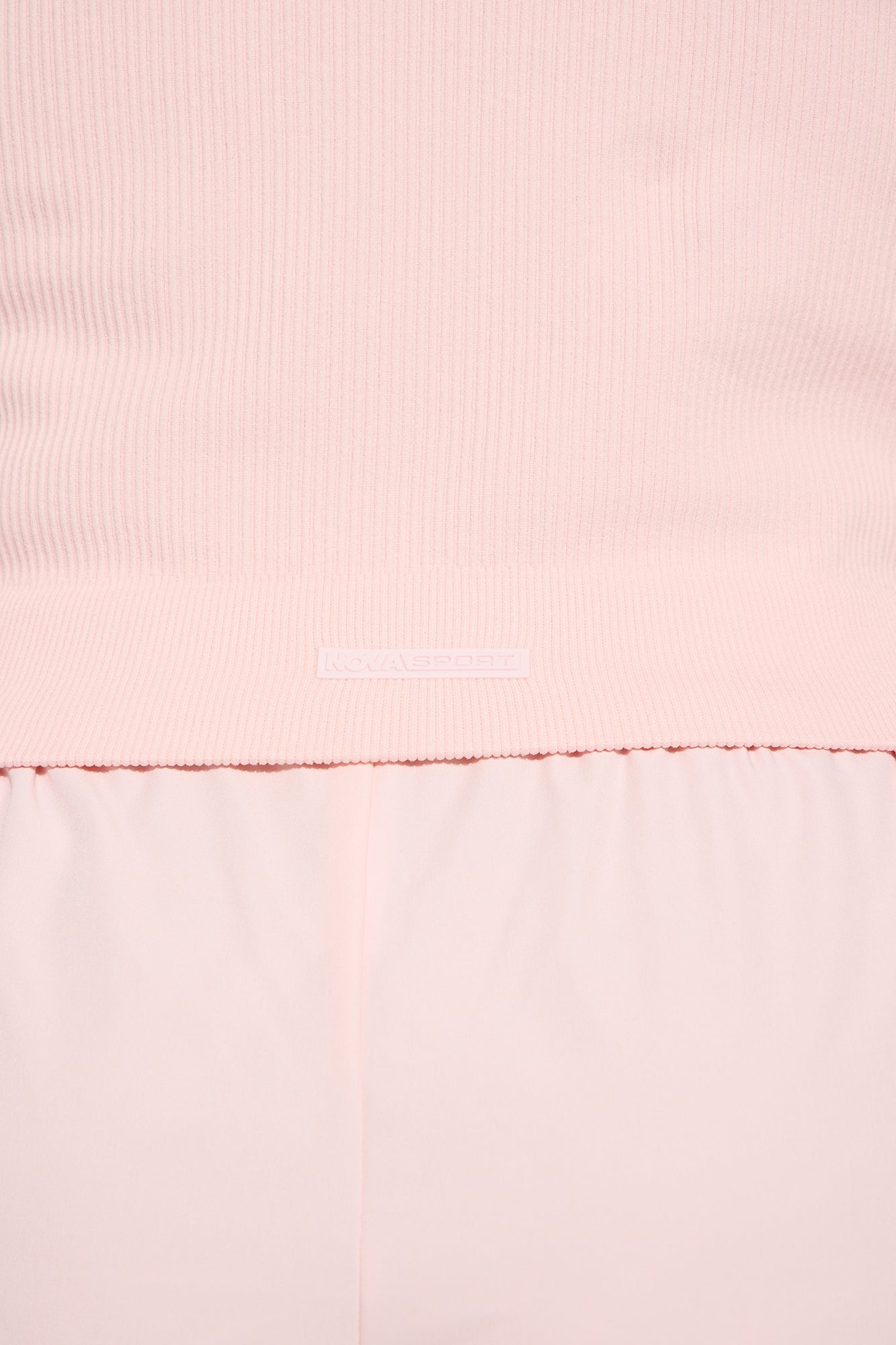 Close-up of Nova Sport women's blush active shorts with a soft waistband and lightweight fabric