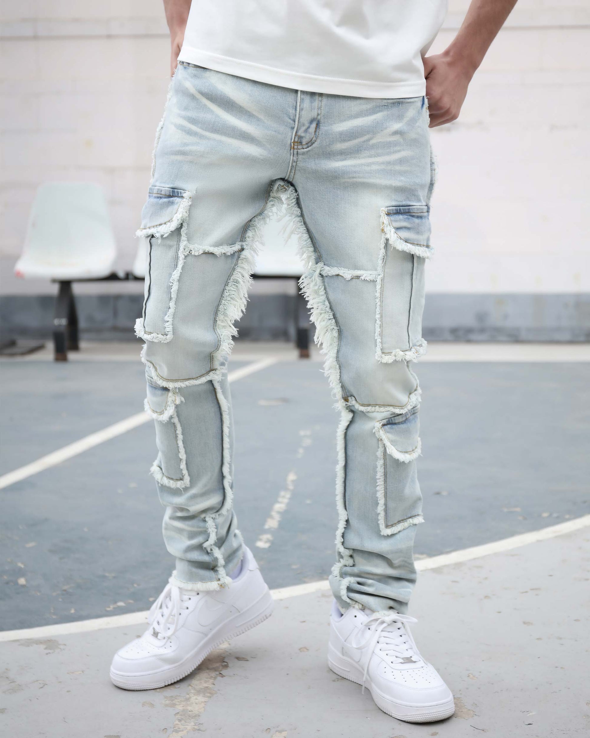 Logeqi workwear flared jeans in light wash with distressed detailing and utility pockets